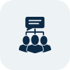 Icon of three people with a speech bubble above them connected by lines, representing group communication or teamwork.
