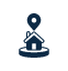 Dark blue icon of a house with a map location pin above it, set on a circular base, against a white background.